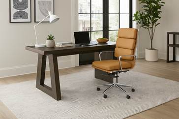 Executive cabin setup with a hand-tufted rug, modern desk and leather chair.