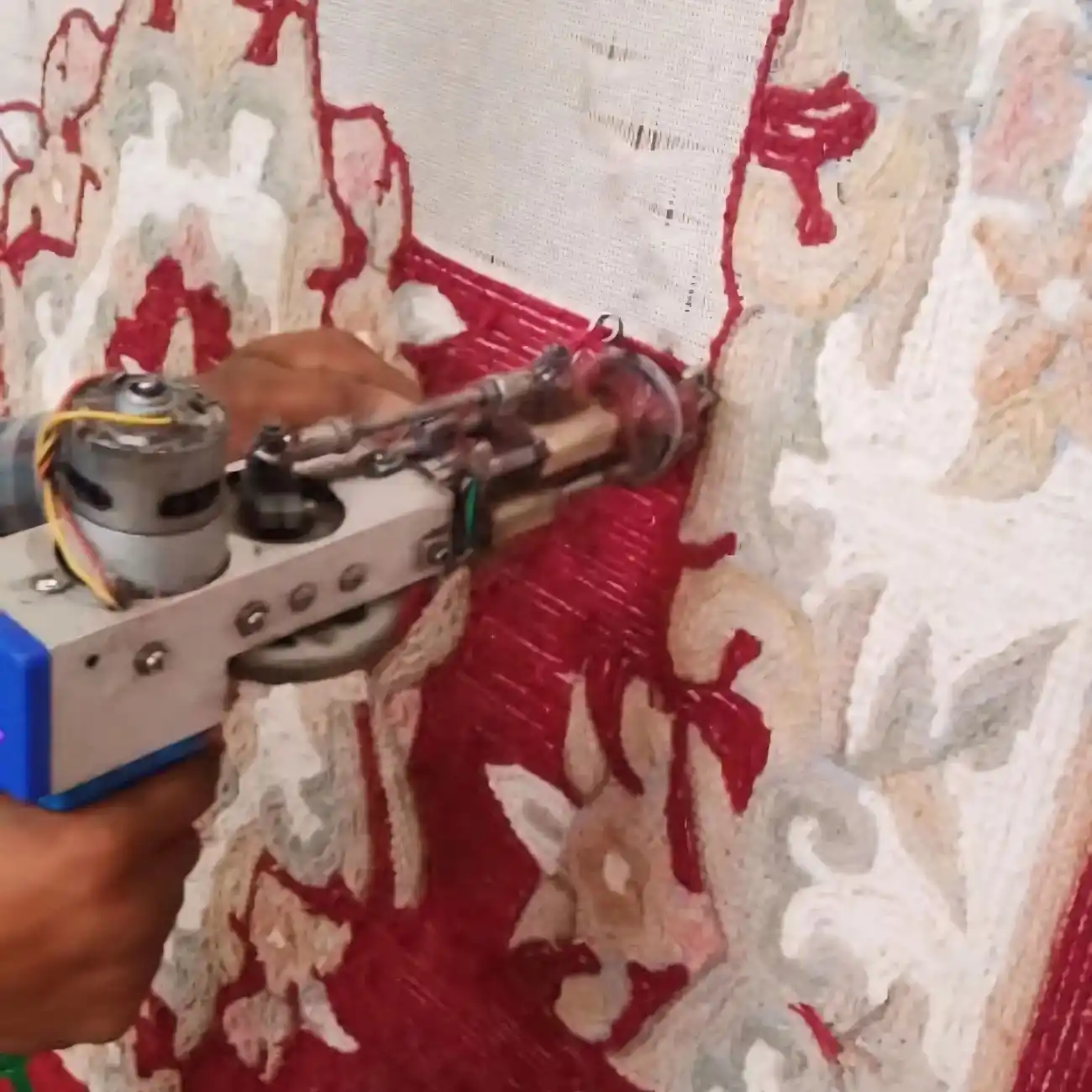 Artisan hand-tufting rug on wooden frame