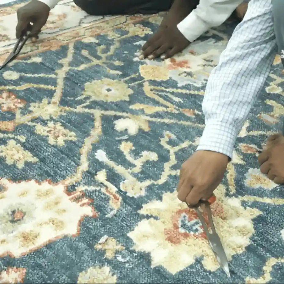 Finishing stage: shearing and trimming the rug surface
