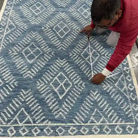 Quality control and export preparation of finished rugs